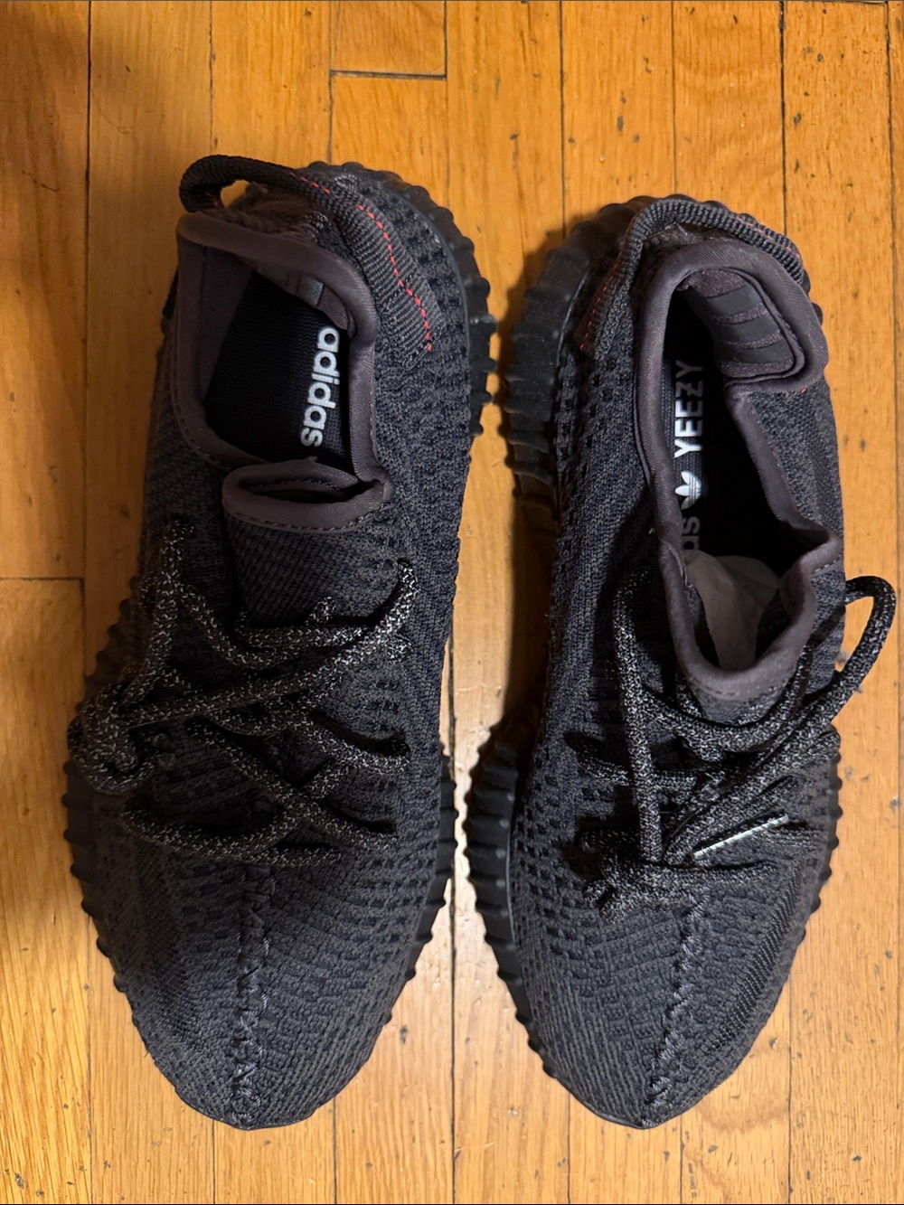 Yeezy Black Knit Low-Top Sneakers with Subtle Red Accent